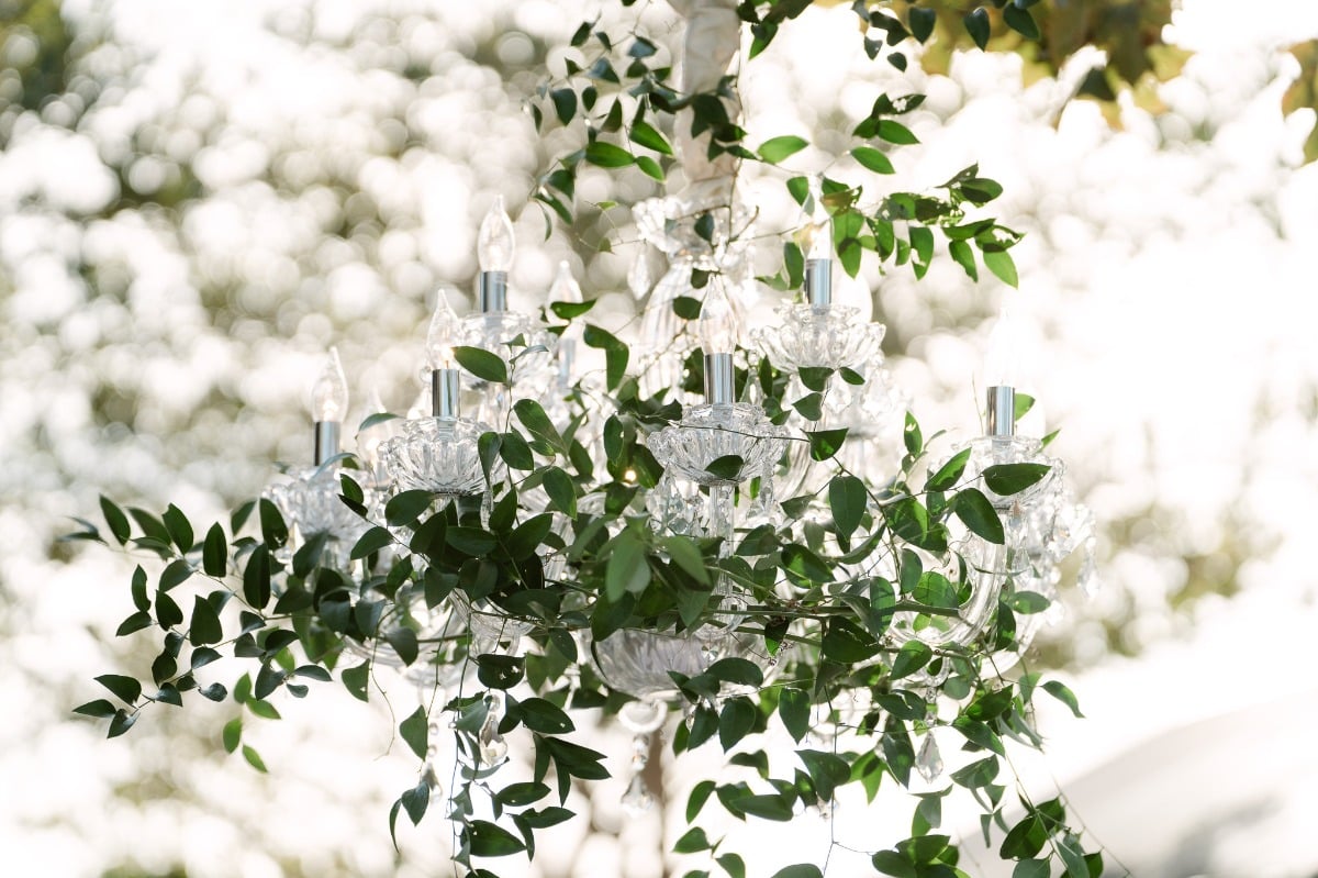 Greenery adorned wedding chandelier 