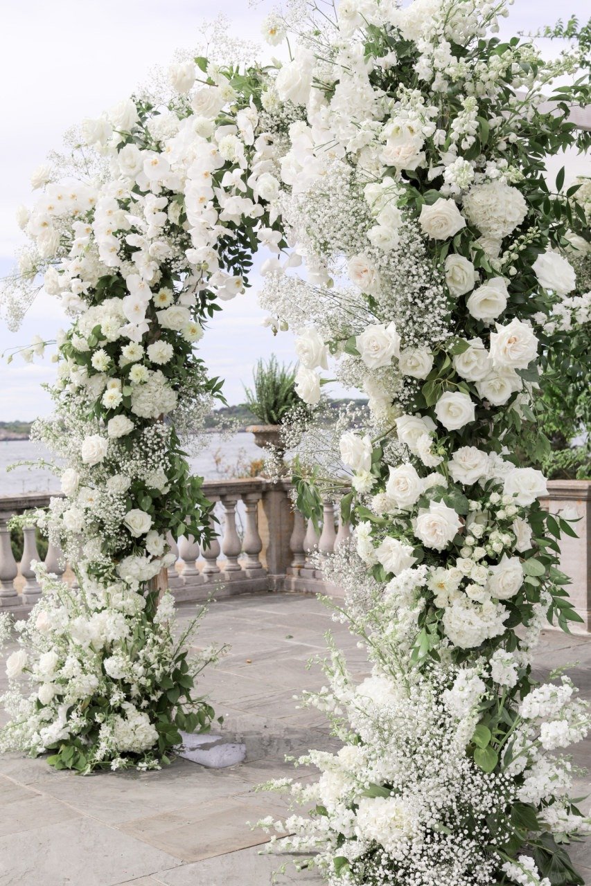 venue on Newport beach with white floral arch